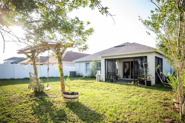 11567 Misty Isle Ln, Riverview, FL 33579 - rear view of property featuring stucco siding, a shingled roof, and central AC unit