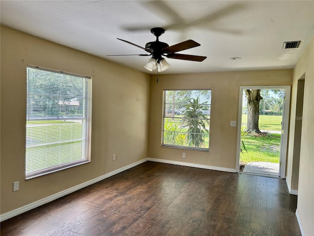 304 Bell St, Wauchula, FL 33873 - spare room with wood finished floors, ceiling fan, baseboards, and a textured ceiling