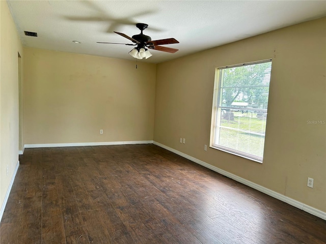 304 Bell St, Wauchula, FL 33873 - unfurnished room featuring wood finished floors, a ceiling fan, and baseboards