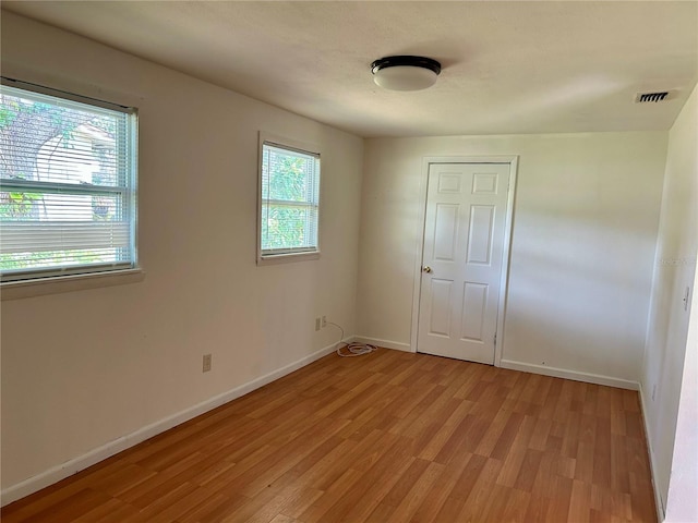 304 Bell St, Wauchula, FL 33873 - spare room with light wood-type flooring and baseboards