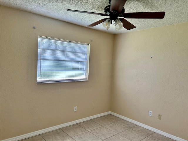 304 Bell St, Wauchula, FL 33873 - empty room featuring light tile patterned floors, a textured ceiling, ceiling fan, and baseboards