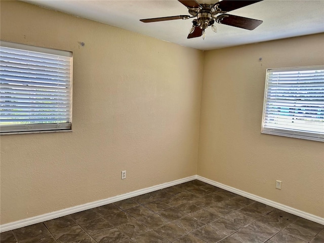 304 Bell St, Wauchula, FL 33873 - empty room featuring plenty of natural light, a ceiling fan, and baseboards