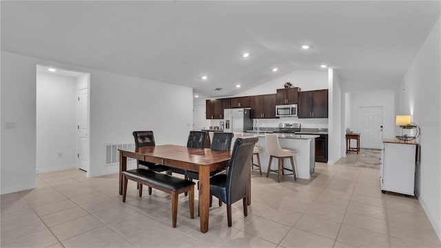 2966 Flying Blackbird Rd, Bartow, FL 33830 - dining room featuring vaulted ceiling, baseboards, light tile patterned floors, and recessed lighting