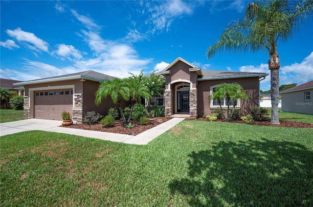 6339 Alamanda Hills Dr, Lakeland, FL 33813 - view of front of house with stone siding, stucco siding, driveway, and a front yard