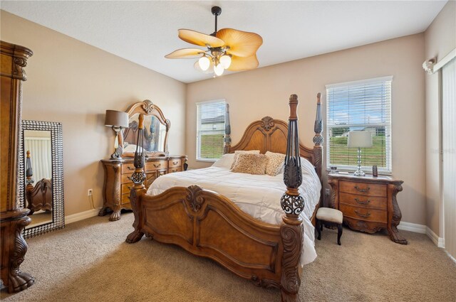 6339 Alamanda Hills Dr, Lakeland, FL 33813 - bedroom featuring light carpet, baseboards, and a ceiling fan