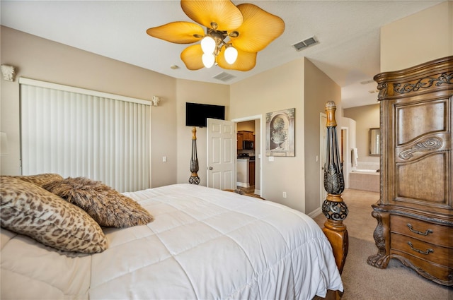 6339 Alamanda Hills Dr, Lakeland, FL 33813 - bedroom with carpet floors, ensuite bath, ceiling fan, and baseboards