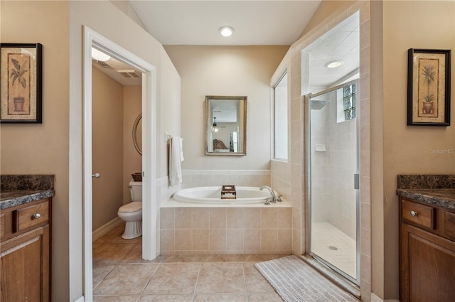 6339 Alamanda Hills Dr, Lakeland, FL 33813 - bathroom with vanity, a bath, a stall shower, and tile patterned flooring