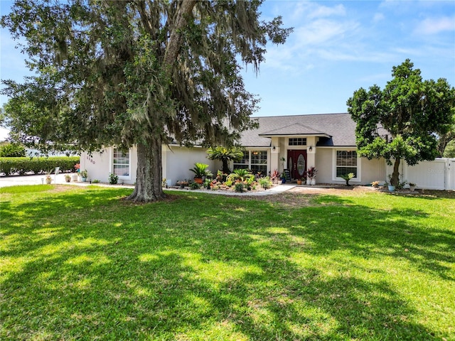 1130 Ewell Rd, Lakeland, FL 33811 - view of front facade with stucco siding and roof with shingles