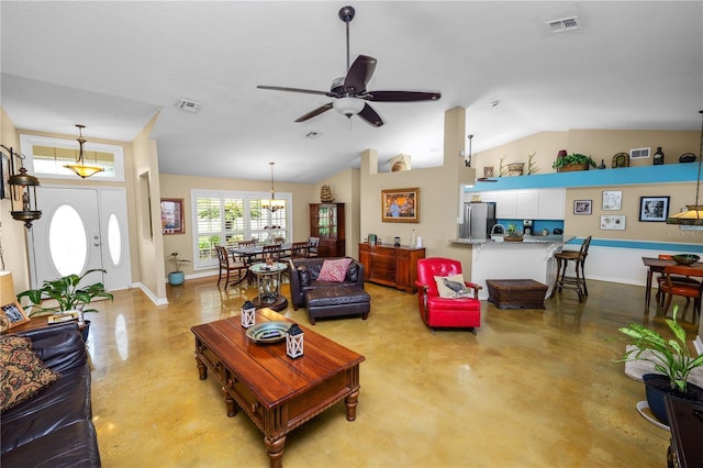 1130 Ewell Rd, Lakeland, FL 33811 - living room featuring a ceiling fan, vaulted ceiling, finished concrete floors, baseboards, and a chandelier