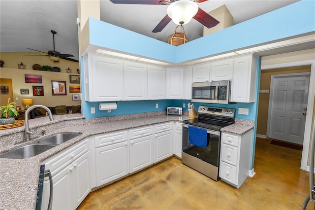 1130 Ewell Rd, Lakeland, FL 33811 - kitchen featuring stainless steel appliances, ceiling fan, a sink, finished concrete flooring, and white cabinetry
