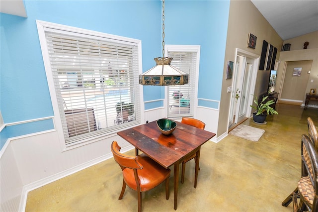 1130 Ewell Rd, Lakeland, FL 33811 - dining area with baseboards, finished concrete floors, and a high ceiling