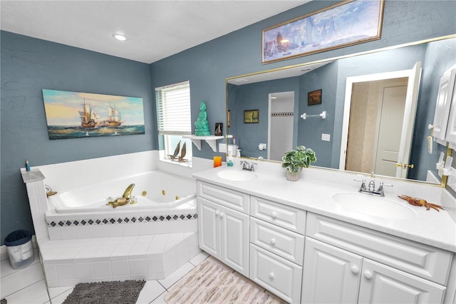 1130 Ewell Rd, Lakeland, FL 33811 - full bathroom with double vanity, a tub with jets, and tile patterned floors