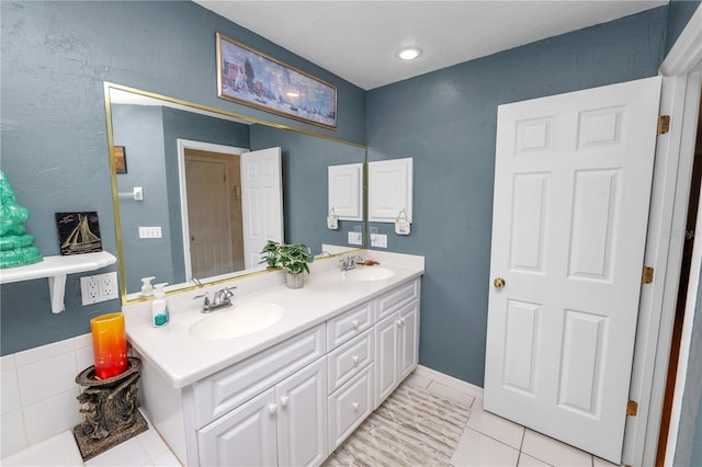 1130 Ewell Rd, Lakeland, FL 33811 - bathroom with double vanity and tile patterned floors