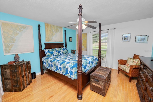 1130 Ewell Rd, Lakeland, FL 33811 - bedroom with light wood finished floors, baseboards, a ceiling fan, and a textured ceiling