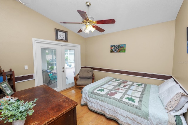 1130 Ewell Rd, Lakeland, FL 33811 - bedroom featuring french doors, vaulted ceiling, access to exterior, light wood finished floors, and a ceiling fan