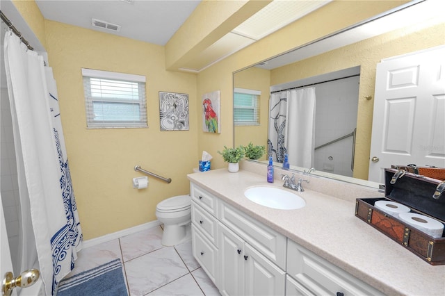 1130 Ewell Rd, Lakeland, FL 33811 - bathroom with toilet, vanity, marble finish floors, a shower with curtain, and baseboards