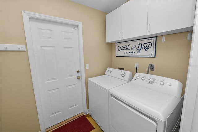 1130 Ewell Rd, Lakeland, FL 33811 - laundry area featuring washing machine and dryer and cabinet space