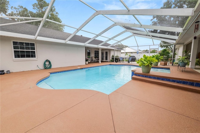 1130 Ewell Rd, Lakeland, FL 33811 - outdoor pool with a patio, a hot tub, and glass enclosure