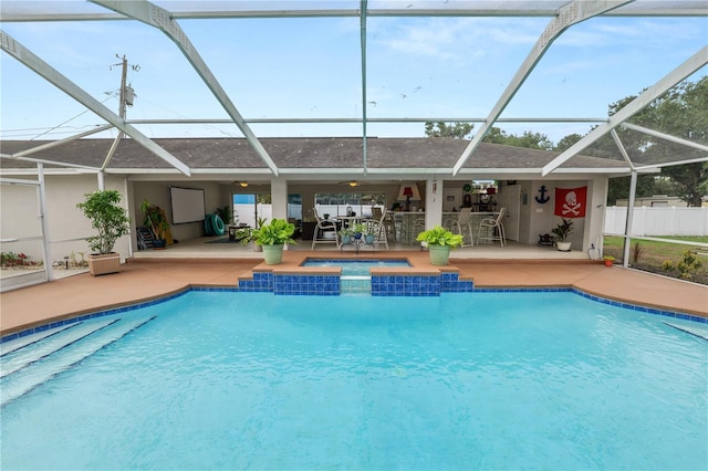 1130 Ewell Rd, Lakeland, FL 33811 - outdoor pool featuring a patio, a hot tub, and glass enclosure