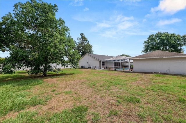 1130 Ewell Rd, Lakeland, FL 33811 - view of grassy yard with glass enclosure