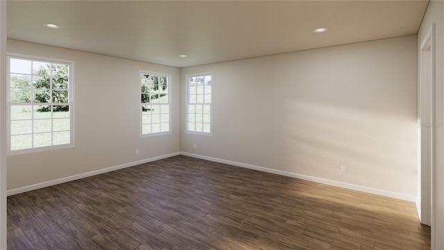 445 Silverbell Trl, Saint Cloud, FL 34771 - unfurnished room featuring dark wood-type flooring, baseboards, and recessed lighting
