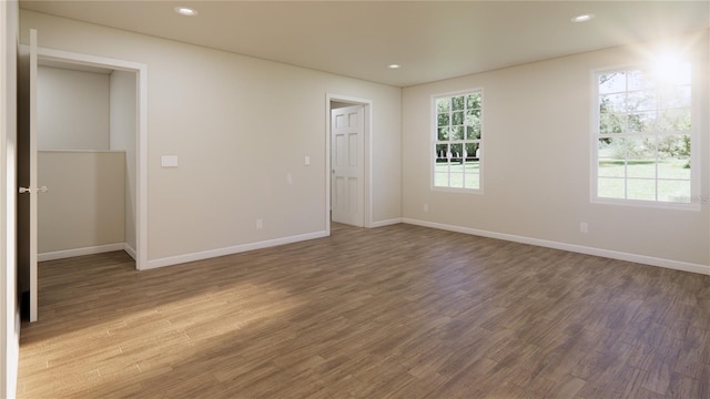 445 Silverbell Trl, Saint Cloud, FL 34771 - empty room with wood finished floors, baseboards, and recessed lighting