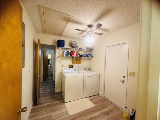 2430 Gresham St, Sebring, FL 33875 - laundry area featuring attic access, washing machine and clothes dryer, light wood-type flooring, a ceiling fan, and a textured ceiling