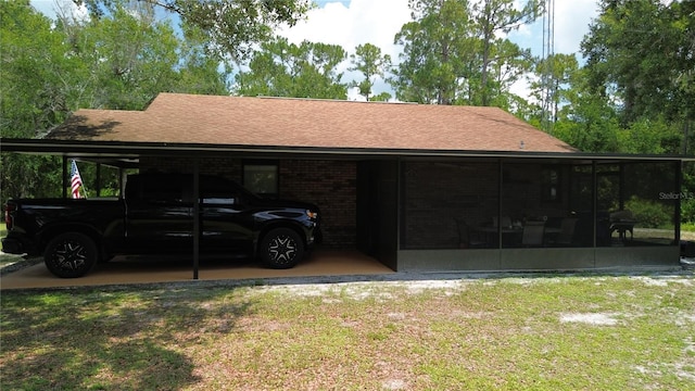 2430 Gresham St, Sebring, FL 33875 - view of parking / parking lot featuring an attached carport