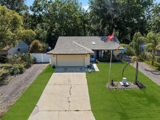 13411 Whitby Rd, Hudson, FL 34667 - ranch-style home featuring driveway, a shingled roof, a garage, and stucco siding