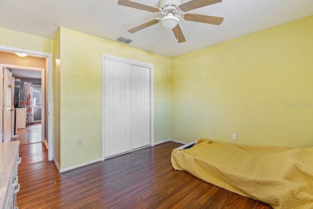 13411 Whitby Rd, Hudson, FL 34667 - bedroom featuring wood finished floors, baseboards, a closet, a textured ceiling, and ceiling fan