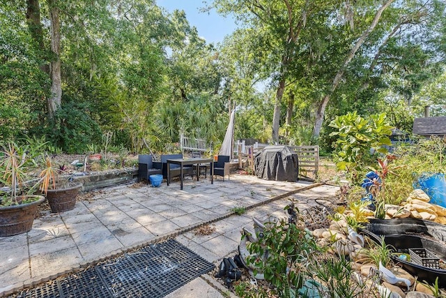13411 Whitby Rd, Hudson, FL 34667 - view of patio featuring outdoor dining area and a grill
