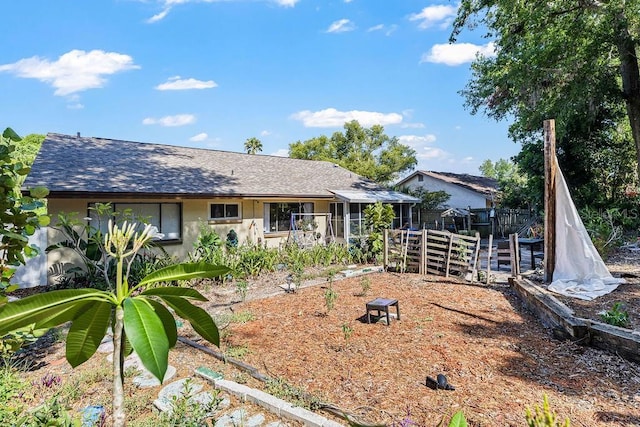 13411 Whitby Rd, Hudson, FL 34667 - view of front of house with stucco siding and a shingled roof