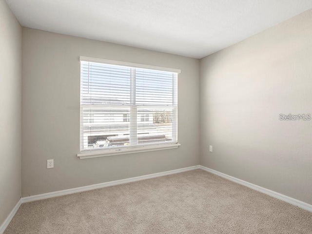 5771 Freshwater Canyon Dr, Saint Cloud, FL 34771 - carpeted spare room with baseboards