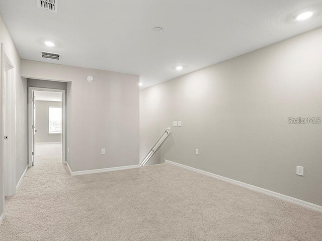 5771 Freshwater Canyon Dr, Saint Cloud, FL 34771 - spare room featuring light carpet, recessed lighting, and baseboards