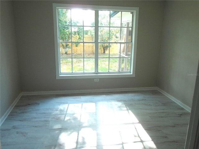 4629 Harden Blvd, Lakeland, FL 33813 - empty room featuring baseboards and marble look tiles