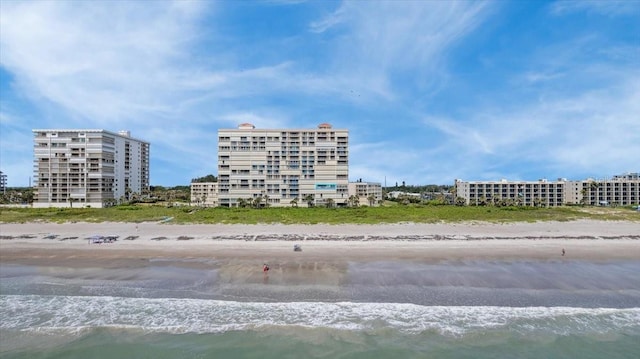 830 N Atlantic Ave Unit B502, Cocoa Beach, FL 32931 - view of building exterior with view of water and beach