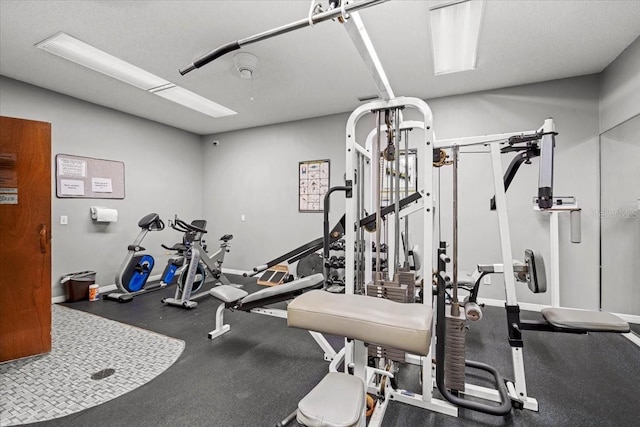 830 N Atlantic Ave Unit B502, Cocoa Beach, FL 32931 - exercise room featuring baseboards