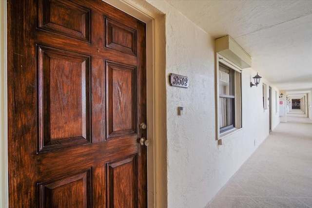 830 N Atlantic Ave Unit B502, Cocoa Beach, FL 32931 - doorway to property featuring a porch and stucco siding