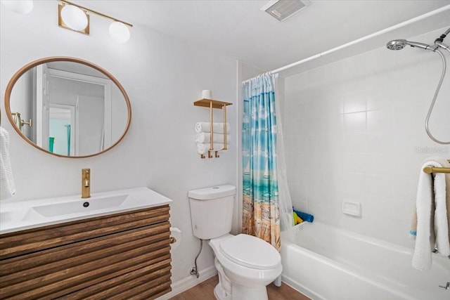 830 N Atlantic Ave Unit B502, Cocoa Beach, FL 32931 - bathroom with vanity, toilet, shower / tub combo with curtain, and wood finished floors