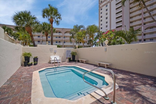 830 N Atlantic Ave Unit B502, Cocoa Beach, FL 32931 - view of pool with a pool, a fenced backyard, and a patio