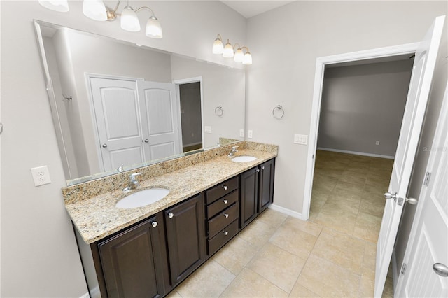 4125 Prima Lago Cir, Lakeland, FL 33810 - full bathroom with double vanity, baseboards, and tile patterned flooring