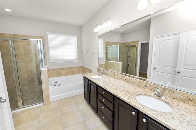 4125 Prima Lago Cir, Lakeland, FL 33810 - full bath featuring a shower stall, tile patterned floors, a bath, and double vanity