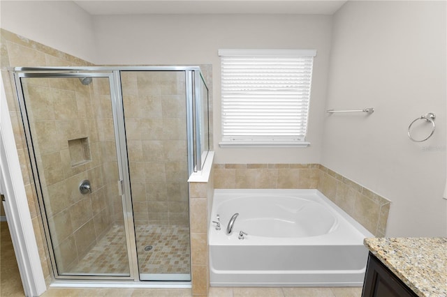 4125 Prima Lago Cir, Lakeland, FL 33810 - bathroom featuring a garden tub, vanity, and a shower stall
