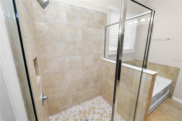 4125 Prima Lago Cir, Lakeland, FL 33810 - full bath featuring a stall shower, a bath, and tile patterned flooring