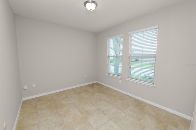 4125 Prima Lago Cir, Lakeland, FL 33810 - unfurnished room with baseboards and light tile patterned flooring
