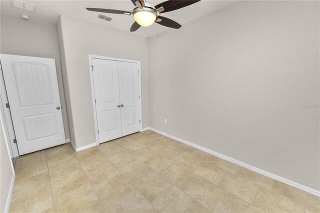 4125 Prima Lago Cir, Lakeland, FL 33810 - unfurnished bedroom with baseboards, a closet, and a ceiling fan
