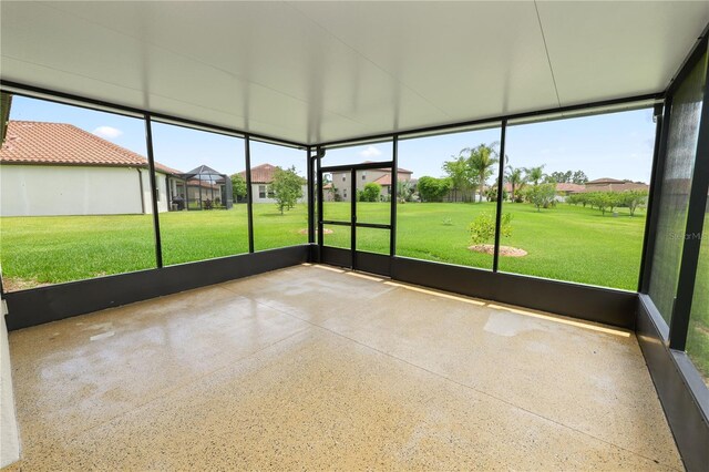 4125 Prima Lago Cir, Lakeland, FL 33810 - unfurnished sunroom featuring a residential view