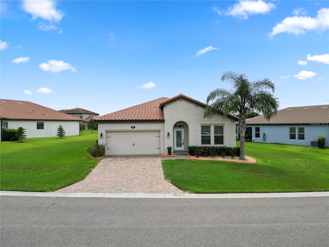 4125 Prima Lago Cir, Lakeland, FL 33810 - mediterranean / spanish-style house with stucco siding, a garage, a front yard, a tiled roof, and driveway