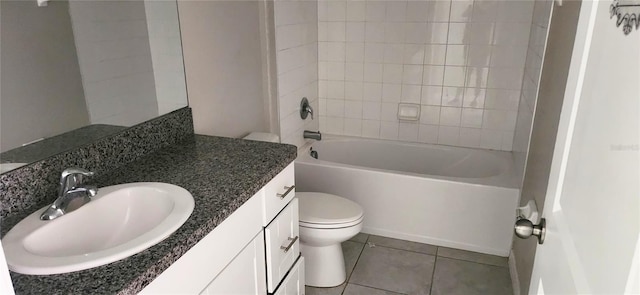 3188 Nubbin Ridge Ln, Zephyrhills, FL 33540 - full bath with toilet, tile patterned floors, vanity, and washtub / shower combination
