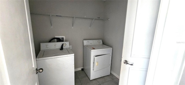3188 Nubbin Ridge Ln, Zephyrhills, FL 33540 - washroom featuring washer and dryer, light tile patterned flooring, and baseboards